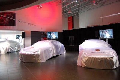 Downtown Porsche draped white slip covers over three new Panameras—the company's first four-door sedan—prior to the unveiling.