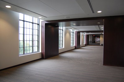 Walnut panels add detail to the south corridor on the second floor.