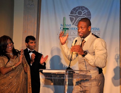 Foundation president Lucy Morillo and hospital C.E.O. Dr. M. Narendra Kini inducted N.B.A. All Star and Miami Heat player Dwyane Wade into the foundation's International Pediatrics Hall of Fame.