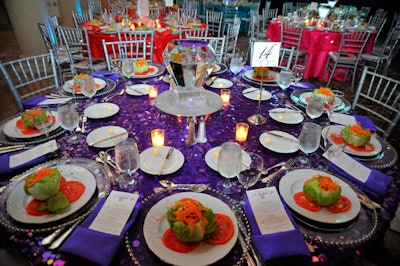Nuage provided purple, pink, orange, and yellow linens for the dinner tables, which each held an ice sculpture centerpiece.