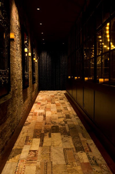 Glass on the right side of the entrance comes from casement windows in the old New York Times building on 43rd Street in in New York—and is among many artifacts and antiques in the space.