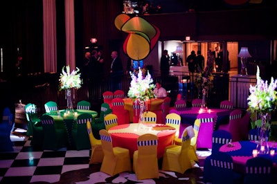 Four-foot-tall centerpieces topped each table, supported by a 36-inch upside down vase.
