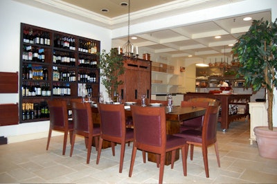 The 12-seat Chef's Table has a view of the open kitchen and the restaurant's international wine collection.