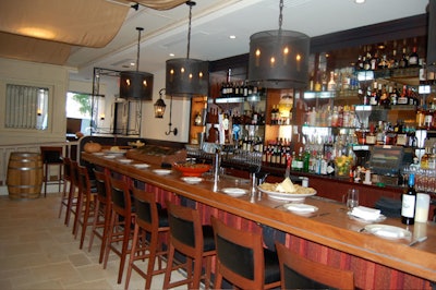 The 60-seat bar and lounge has a stone floor and waves of beige silk on the ceiling.
