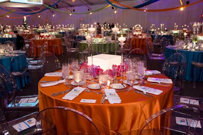 In the dinner tent, Heffernan Morgan topped tables with candles, light boxes, and bright flowers.