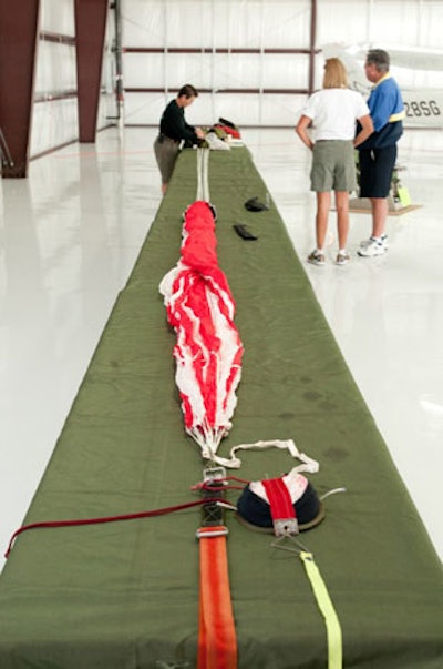 A representative from Strong Parachutes demonstrated how to properly pack a parachute.