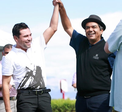 Oscar De La Hoya and George Lopez posed at the championship pro-am.