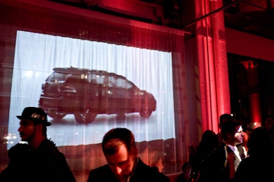 Sheer curtains on the windows served as screens for projections of GTI promotional videos.