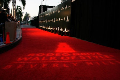 A gobo on the red carpet showed the evening's logo, and a black press wall served as the backdrop for arrivals to the Rodeo Drive Walk of Style awards.