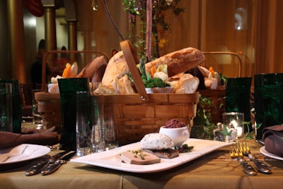 Whimsical touches included a first course of French baguettes, displayed in picnic baskets on the dining tables, accompanied by mushroom-goat cheese spread, black olive tapenade, and chicken liver pâté.