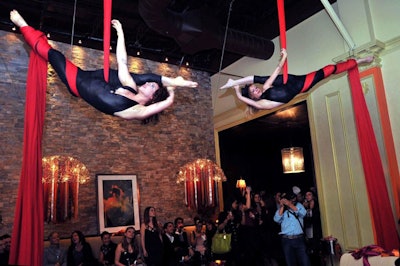 Femmes du Feu performed on red silk suspended from the 17-foot-high ceilings at Oasi.