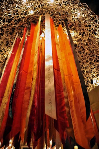Red, orange, and purple satin ribbons hung from chandeliers throughout the venue.