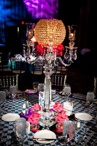 Pink roses and crystal candelabra topped tables throughout the dining room.