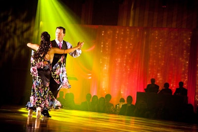 Six community leaders, each paired with a professional dancer, participated in a ballroom dance competition during the gala.