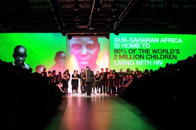 The Nathaniel Dett Chorale sang while HIV/AIDS statistics were projected onto the wall.