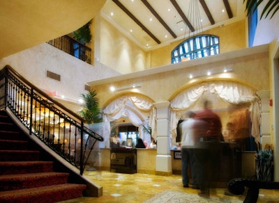The main entrance to the restaurant has a grand staircase with ironwork detailing.