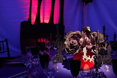 Almost hidden by the dim lighting, each table's centerpiece contained black paper flowers and skull shapes dipped in black glitter.