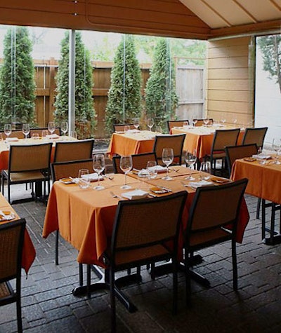 An enclosed garden can host seated dinners for 32.