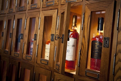 A wall of annual-rent lockers is the key design element of the eight-seat private Scotch Locker Room.