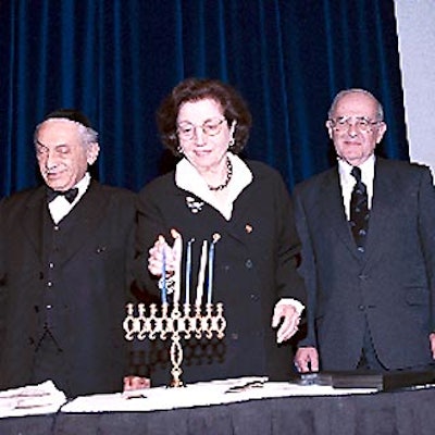 Four Holocaust survivors, including Maurice Katz, Clara Feldman and Karl Schapiro, lit the Chanukah candles at the Simon Wiesenthal Center annual benefit dinner. (Photo by Ron Glassman)