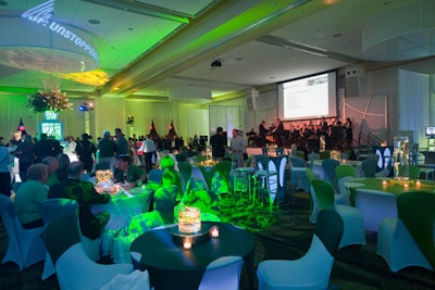Showorks drenched the ballroom in green and orange lighting.