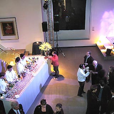 The main portion of the event was held on the museum's first floor, where a small corrugated steel stage was set in the corner for Jewel's performance.