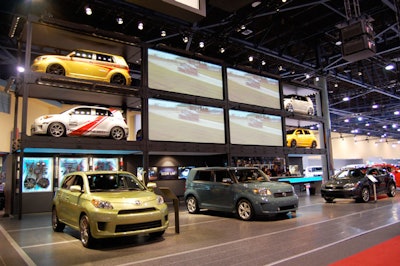 Scion's exhibit, one of the largest displays on the show floor, had eight of its cars on a truss system with retractable video screens for each section displaying promotional videos for the company.