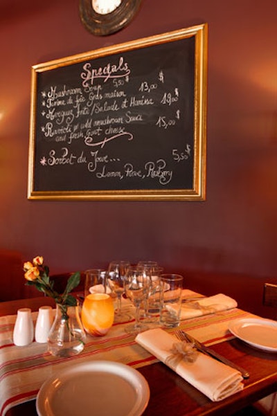 Gold-framed chalkboards in the dining room display the hand-written specials of the day.
