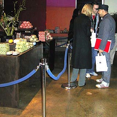 Blue velvet ropes set up within the store kept guests from sitting--or spilling--on some of the merchandise, and kept them lined up for the next sample station.