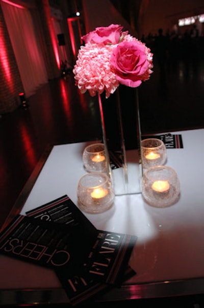 Floral arrangements from Pink Twig Floral Boutique topped tables throughout the venue.