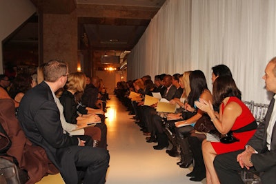 Models walked down an 80-foot 'Glam ' floor that paved the shopping center's north atrium corridor.