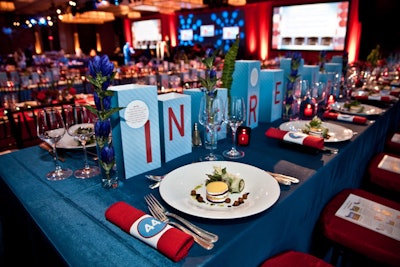 Rows of paper rectangles spelled out 'in' words at the Boston Brigham Women's Hospital 'In Party' fund-raiser in September. Upon closer inspection, the centerpieces listed facts about the programs the fund-raiser would benefit.