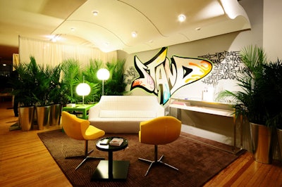 Former HGTV Design Star contestant Nathan Galui used graffiti to decorate the wall of his lounge space, which Ligne Roset furnished.