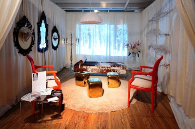 Stephanie Franz's 'Winter Wonderland ' space had furnishings from Ligne Roset and KMP Furniture and a video projection of a snowy forest on its back wall of drape.