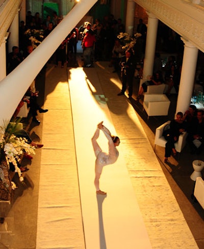 An acrobat from Animate Object physical theater performed on the main floor before the live auction and Chloé fashion show.