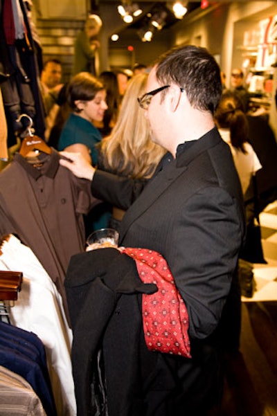 Guests browsed the racks of clothing.