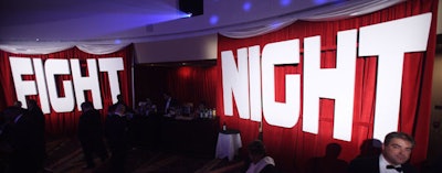 As part of the old-school Mad Men vibe at the Hilton Washington, red curtains in the corner served as a backdrop for giant white letters spelling out 'Fight Night. '