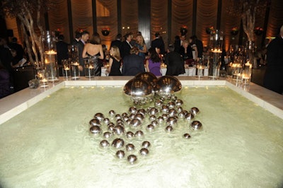 The eponymous pool in the Four Seasons Pool Room had faux mercury balls floating in it, styled by Bronson van Wyck.