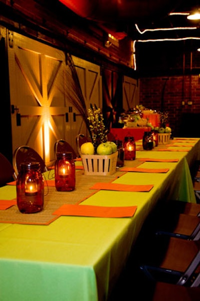 Baskets of apples and fall foliage and candles inside colored mason jars served as centerpieces.
