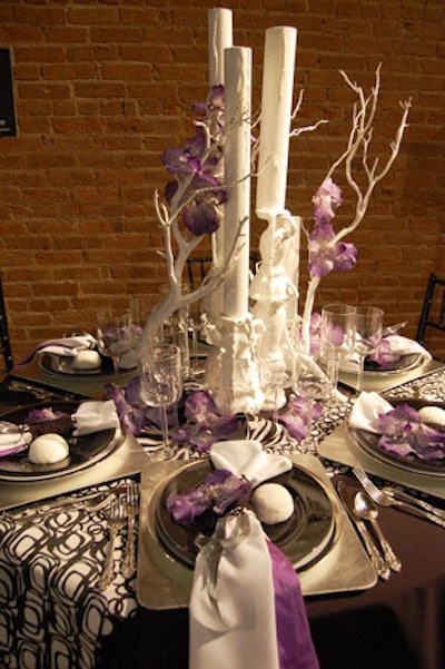 The Wizard Studios tabletop included a faux melted candle centerpiece, purple orchids, square silver chargers, and for a playful touch, white Sno Balls on each setting.