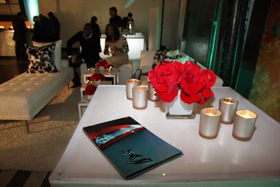At Kehoe's sleek lounge setups, tables held candles, roses, and catalogs with information about Jaguar's new models.