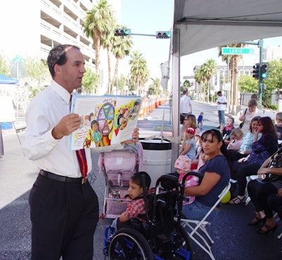 Local TV weatherman Kevin Janison read aloud from his children's book.