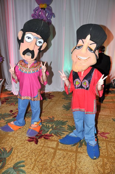 C&J Productions provided wandering entertainers for the cocktail reception, including four dressed as the Beatles and wearing oversize caricature heads.