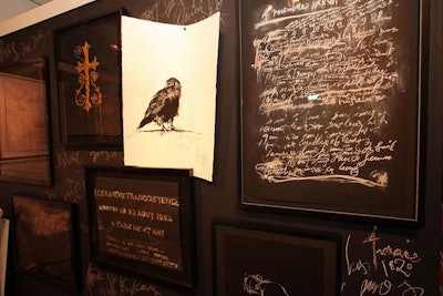Chalkboard walls and charcoal drawings of crows surrounded artist Francine Turk's table.
