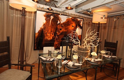 A sepia photograph of nuzzling horses hung behind the table designed by Richar Interiors Inc.