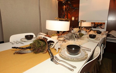 White fur and antlers decorated Allsteel by Epstein International's woodsy table.