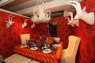 The table from Julie Bova Interior Design incorporated psychedelic zebra-print linens and white plaster trophy heads.