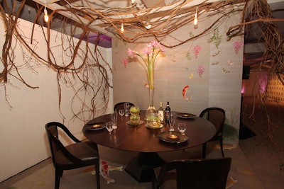 Gary Lee Partners ' Asian-inspired table incorporated a backdrop that resembled a silk painting of koi.