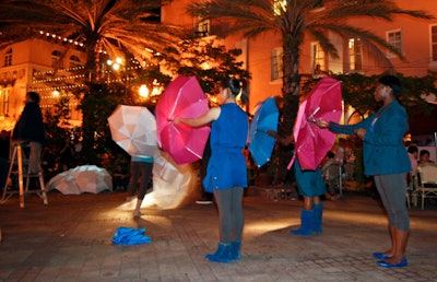 Dancers performed with umbrellas on Espanola Way as part of the 'Remnants and Umbrellas 8-12 ' exhibit, which projected its namesake film onto screens and umbrellas in the Plaza de Espana.