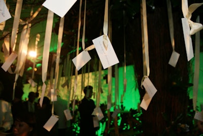 Messages from guests dangled from the wishing tree's ribbons.